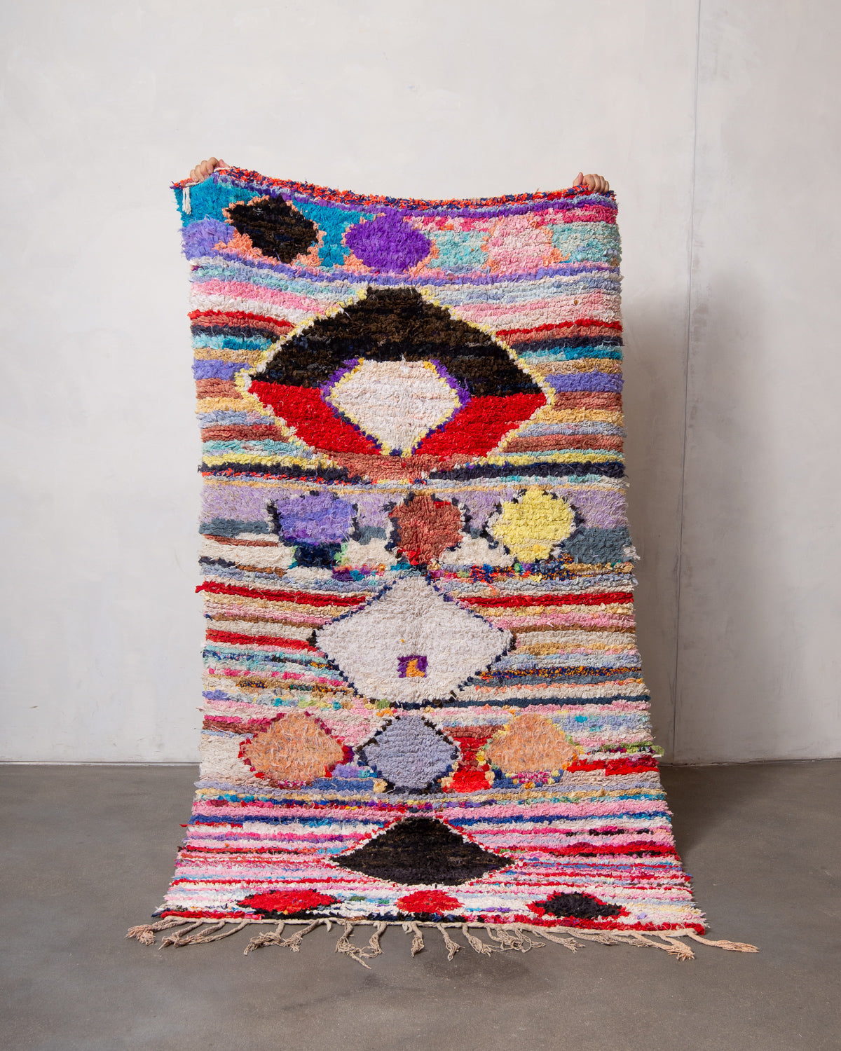 Modern designer vintage handcrafted Berber rug from Morocco. Boucherouite runner rug with beautiful colors and patterns.